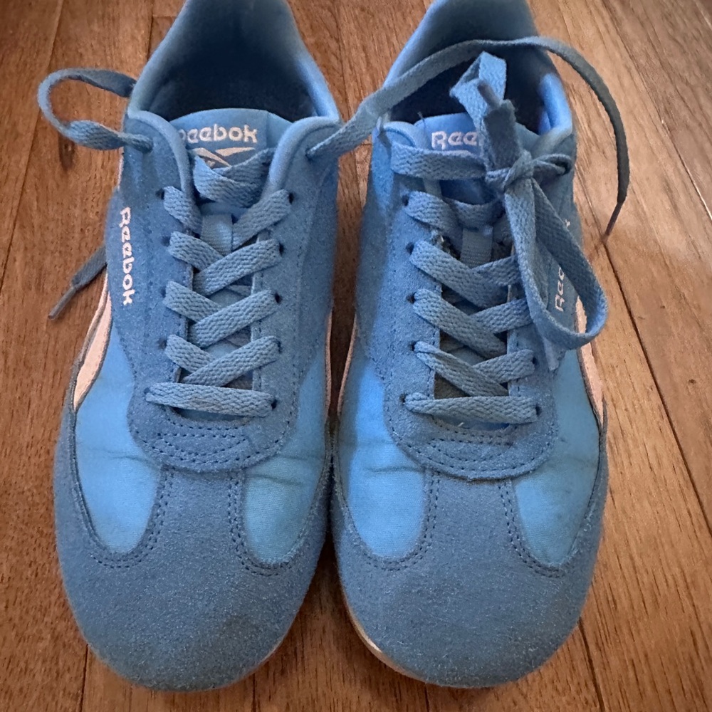 Reebok Women’s Blue Suede with pink sneakers.